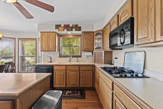 1450 Anvil Ct, Bartlett, IL 60103 - kitchen featuring black appliances, dark wood-style floors, a ceiling fan, and light countertops