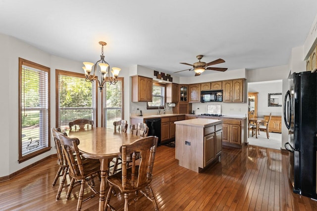 1450 Anvil Ct, Bartlett, IL 60103 - dining space with dark wood-style flooring, a chandelier, and a ceiling fan