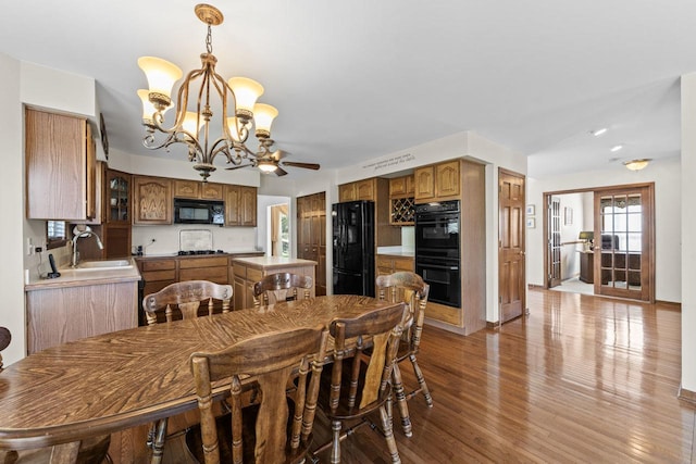 1450 Anvil Ct, Bartlett, IL 60103 - dining room with a chandelier, light wood-type flooring, and a ceiling fan