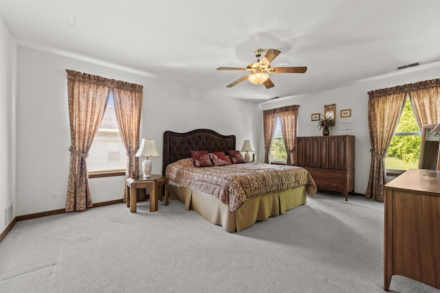 1450 Anvil Ct, Bartlett, IL 60103 - bedroom with multiple windows, light colored carpet, and ceiling fan
