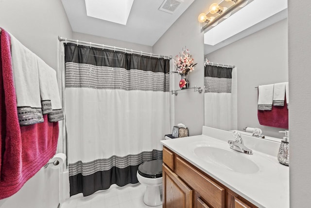 1450 Anvil Ct, Bartlett, IL 60103 - bathroom featuring a skylight, vanity, and a shower with curtain