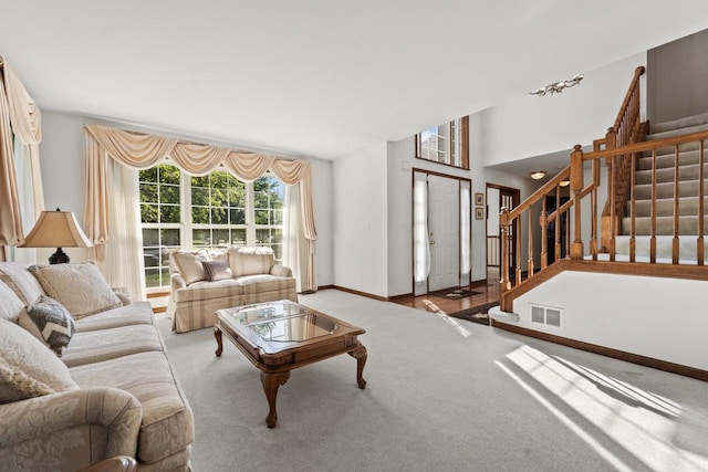 1450 Anvil Ct, Bartlett, IL 60103 - carpeted living area featuring stairway and baseboards