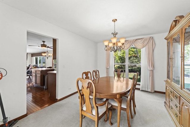 1450 Anvil Ct, Bartlett, IL 60103 - dining space featuring a chandelier, healthy amount of natural light, and light colored carpet