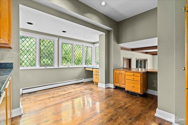 595 Crab Tree Ln, Lake Forest, IL 60045 - kitchen featuring a baseboard radiator, dark wood-type flooring, brown cabinets, recessed lighting, and built in study area