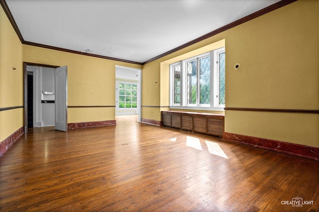 595 Crab Tree Ln, Lake Forest, IL 60045 - empty room with wood finished floors, ornamental molding, and radiator