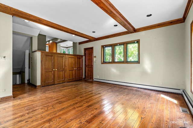 595 Crab Tree Ln, Lake Forest, IL 60045 - spare room with a baseboard radiator, beamed ceiling, plenty of natural light, and wood-type flooring