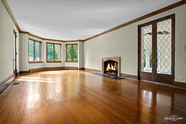 595 Crab Tree Ln, Lake Forest, IL 60045 - unfurnished living room with hardwood / wood-style floors, ornamental molding, french doors, and a fireplace with flush hearth