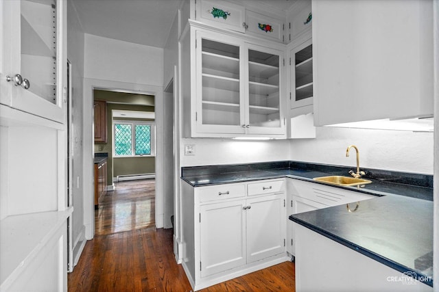 595 Crab Tree Ln, Lake Forest, IL 60045 - kitchen with dark wood-style flooring, white cabinetry, glass insert cabinets, and dark countertops