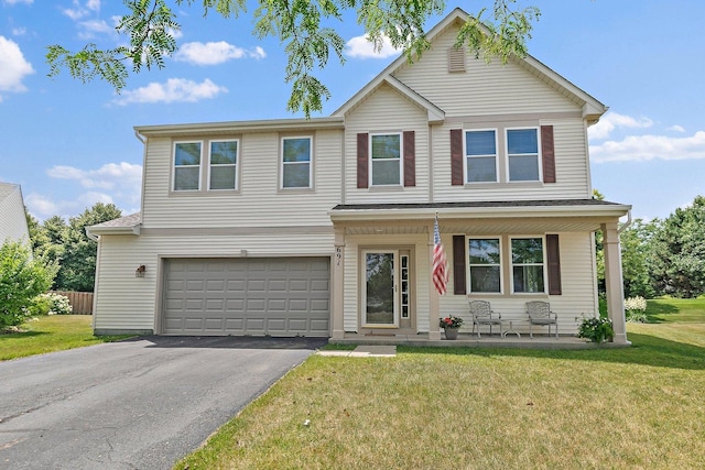 691 Glen Cove Ln, Pingree Grove, IL 60140 - traditional-style home with an attached garage, asphalt driveway, a front yard, and covered porch