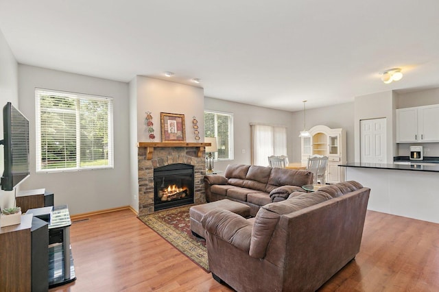 691 Glen Cove Ln, Pingree Grove, IL 60140 - living room featuring light wood-style floors and a fireplace