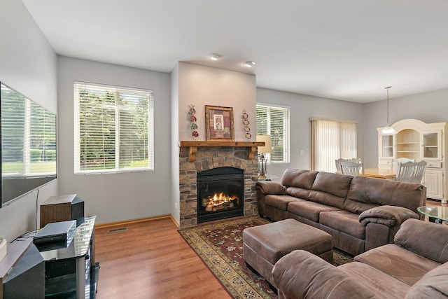 691 Glen Cove Ln, Pingree Grove, IL 60140 - living area featuring a stone fireplace and wood finished floors