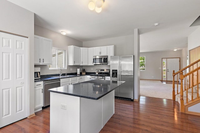 691 Glen Cove Ln, Pingree Grove, IL 60140 - kitchen with appliances with stainless steel finishes, white cabinets, a center island, and dark wood-type flooring