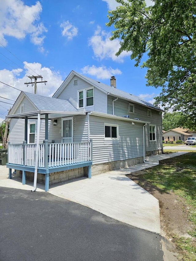 14610 Lincoln Ave, Dolton, IL 60419 - back of house with a chimney and a porch