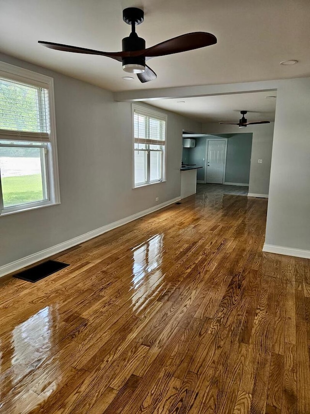 14610 Lincoln Ave, Dolton, IL 60419 - unfurnished living room with a ceiling fan and wood finished floors