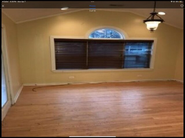6419 S Kenwood Ave, Chicago, IL 60637 - spare room featuring vaulted ceiling and wood finished floors