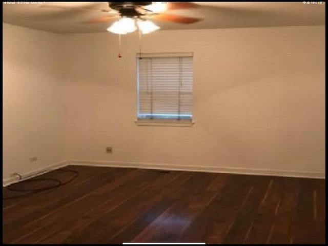 6419 S Kenwood Ave, Chicago, IL 60637 - spare room featuring a ceiling fan and dark wood-type flooring