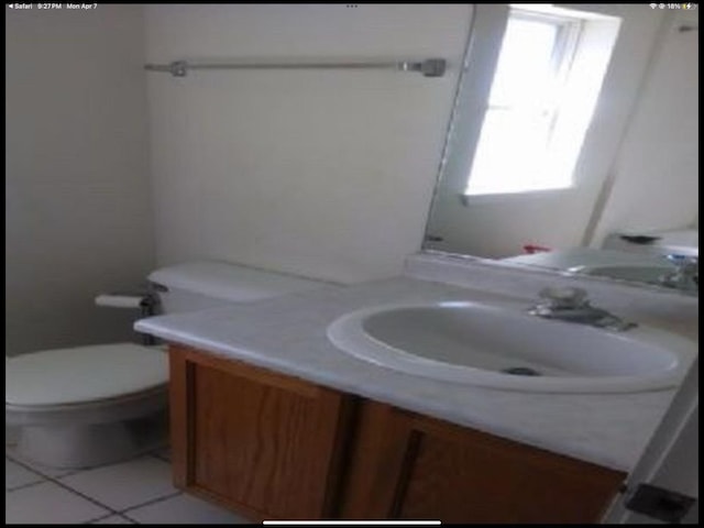 6419 S Kenwood Ave, Chicago, IL 60637 - bathroom with vanity and tile patterned flooring