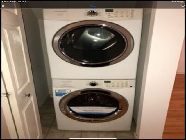 6419 S Kenwood Ave, Chicago, IL 60637 - laundry room with stacked washing machine and dryer and tile patterned floors