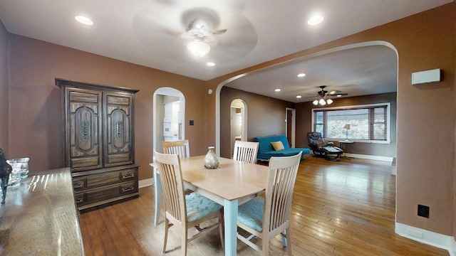 1713 Glenn Park Dr, Champaign, IL 61821 - dining area featuring arched walkways, ceiling fan, hardwood / wood-style flooring, and recessed lighting