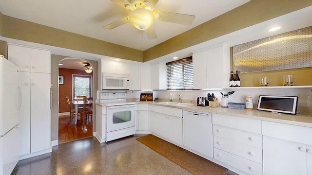 1713 Glenn Park Dr, Champaign, IL 61821 - kitchen with white appliances, a ceiling fan, arched walkways, healthy amount of natural light, and recessed lighting