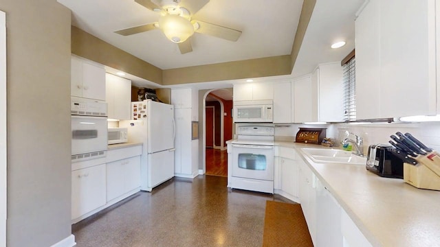 1713 Glenn Park Dr, Champaign, IL 61821 - kitchen featuring white appliances, arched walkways, light countertops, and white cabinetry