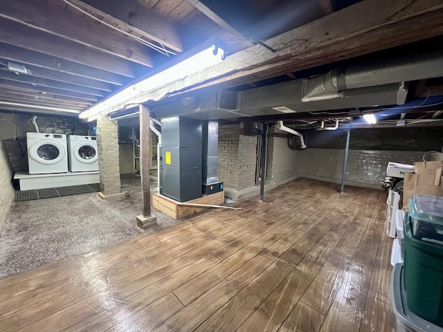 1713 Glenn Park Dr, Champaign, IL 61821 - unfinished basement with washer and dryer, wood-type flooring, and heating unit