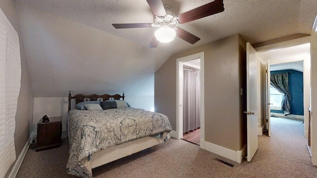 1713 Glenn Park Dr, Champaign, IL 61821 - bedroom with light colored carpet, lofted ceiling, a textured ceiling, and a ceiling fan