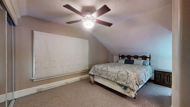 1713 Glenn Park Dr, Champaign, IL 61821 - bedroom featuring lofted ceiling, carpet floors, a textured ceiling, and ceiling fan