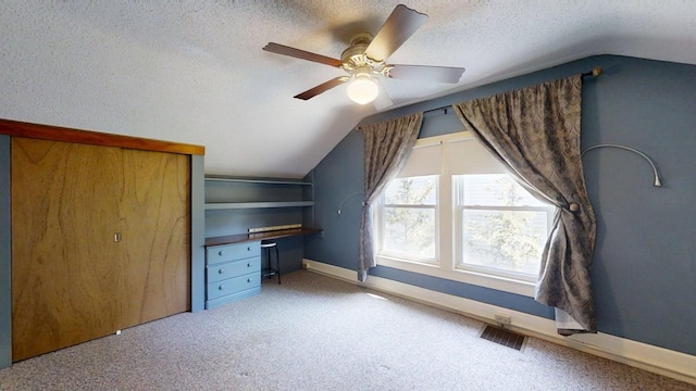 1713 Glenn Park Dr, Champaign, IL 61821 - additional living space featuring vaulted ceiling, carpet, a textured ceiling, and ceiling fan