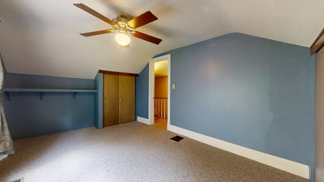 1713 Glenn Park Dr, Champaign, IL 61821 - unfurnished bedroom featuring vaulted ceiling, carpet flooring, a ceiling fan, and a textured ceiling