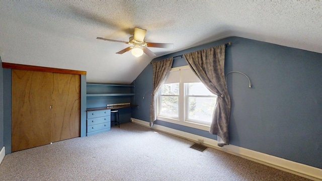 1713 Glenn Park Dr, Champaign, IL 61821 - bonus room with ceiling fan, vaulted ceiling, a textured ceiling, and light colored carpet