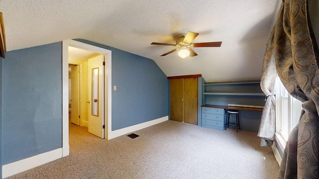 1713 Glenn Park Dr, Champaign, IL 61821 - unfurnished office featuring vaulted ceiling, carpet floors, a ceiling fan, and a textured ceiling