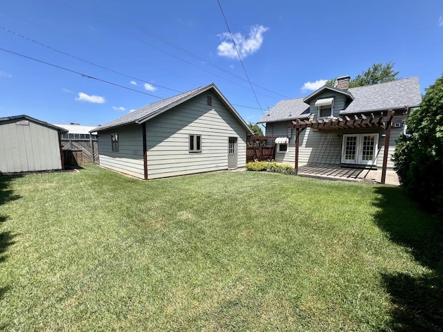 1713 Glenn Park Dr, Champaign, IL 61821 - back of house featuring a pergola, a chimney, an outbuilding, french doors, and a shingled roof