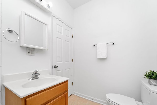 2414 W Bryn Mawr Ave Unit 1W, Chicago, IL 60659 - half bathroom featuring vanity and tile patterned flooring