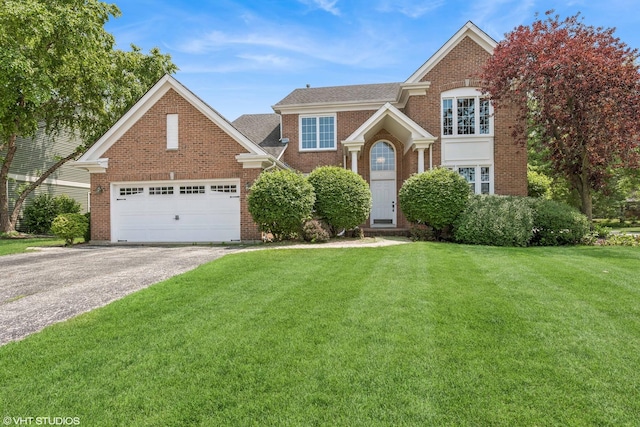 1266 Thorndale Ln, Lake Zurich, IL 60047 - view of front facade featuring brick siding, a front lawn, an attached garage, asphalt driveway, and a shingled roof
