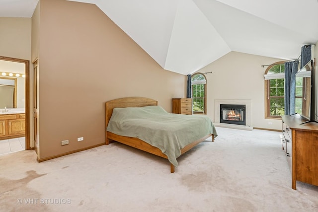1266 Thorndale Ln, Lake Zurich, IL 60047 - bedroom with vaulted ceiling, light colored carpet, a glass covered fireplace, and ensuite bath