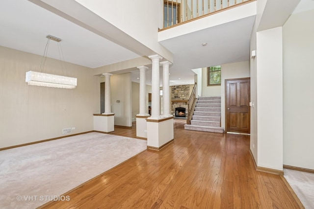 1266 Thorndale Ln, Lake Zurich, IL 60047 - entryway with light wood-style floors and a stone fireplace