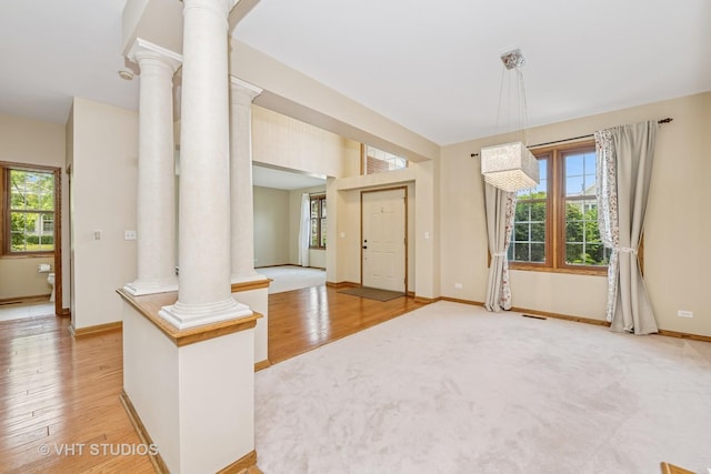 1266 Thorndale Ln, Lake Zurich, IL 60047 - entryway with ornate columns, healthy amount of natural light, and light wood finished floors