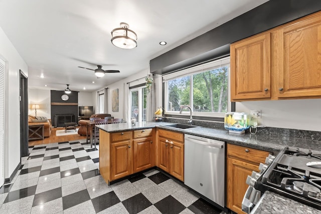 281 S Western Ave, Bartlett, IL 60103 - kitchen with stainless steel dishwasher, recessed lighting, range with gas cooktop, a fireplace, and open floor plan