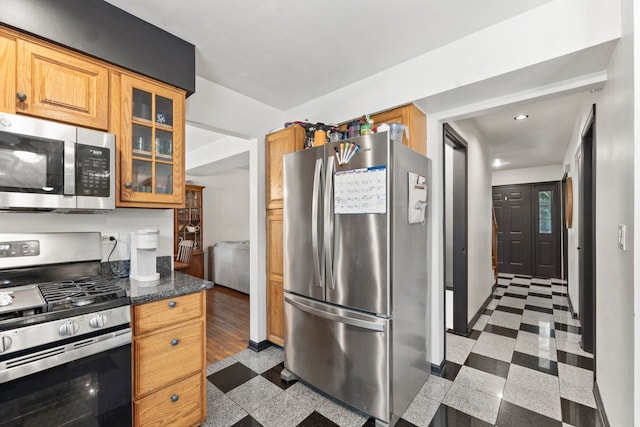 281 S Western Ave, Bartlett, IL 60103 - kitchen featuring stainless steel appliances, granite floors, glass insert cabinets, recessed lighting, and dark stone countertops