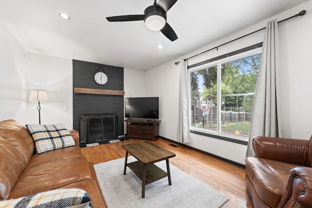 281 S Western Ave, Bartlett, IL 60103 - living room featuring a fireplace, wood finished floors, recessed lighting, and ceiling fan