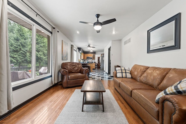 281 S Western Ave, Bartlett, IL 60103 - living area with light wood finished floors, ceiling fan, and plenty of natural light