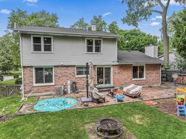 281 S Western Ave, Bartlett, IL 60103 - rear view of property with a chimney, a patio area, an outdoor fire pit, and brick siding