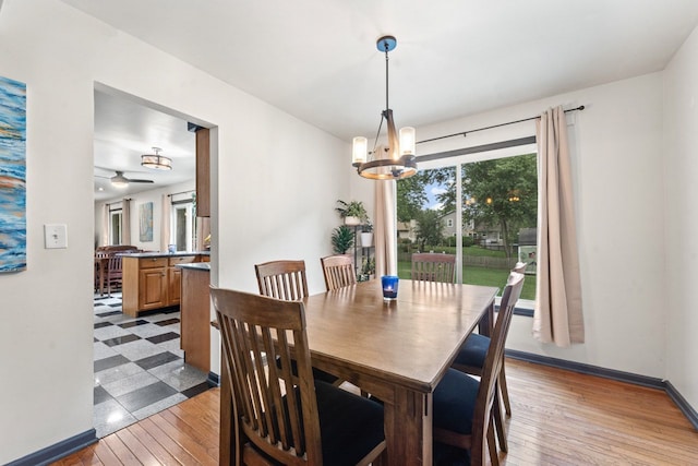 281 S Western Ave, Bartlett, IL 60103 - dining space featuring a chandelier, light wood finished floors, and a ceiling fan