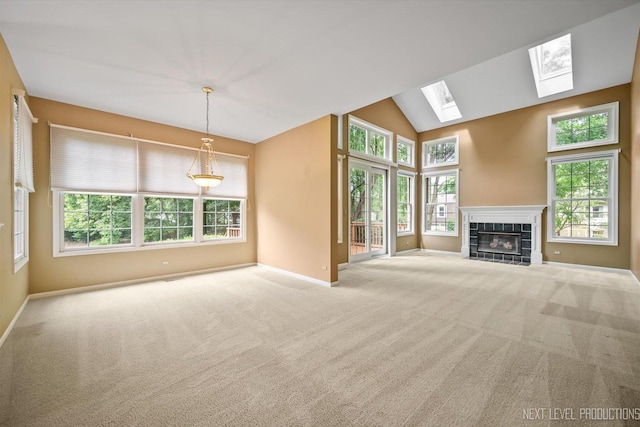1348 Averill Cir, Geneva, IL 60134 - unfurnished living room featuring carpet floors, a tile fireplace, a skylight, and vaulted ceiling