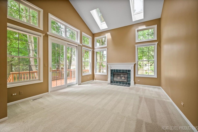1348 Averill Cir, Geneva, IL 60134 - unfurnished living room featuring high vaulted ceiling, a skylight, carpet, and a fireplace