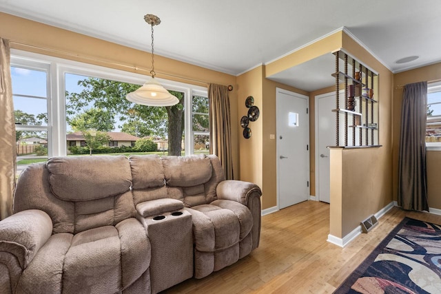 6411 W 88th St, Oak Lawn, IL 60453 - living area with light wood finished floors, healthy amount of natural light, and crown molding