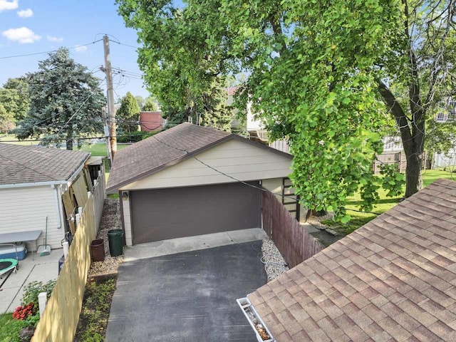 6411 W 88th St, Oak Lawn, IL 60453 - view of home's exterior with a shingled roof and a detached garage