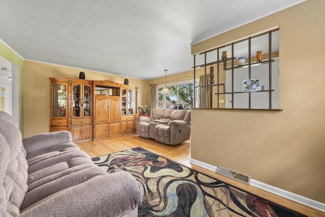 6411 W 88th St, Oak Lawn, IL 60453 - living area featuring light wood finished floors and ornamental molding