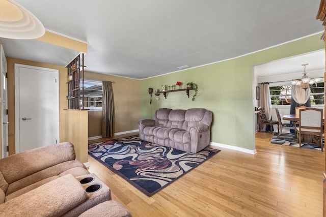 6411 W 88th St, Oak Lawn, IL 60453 - living area featuring wood finished floors and a chandelier